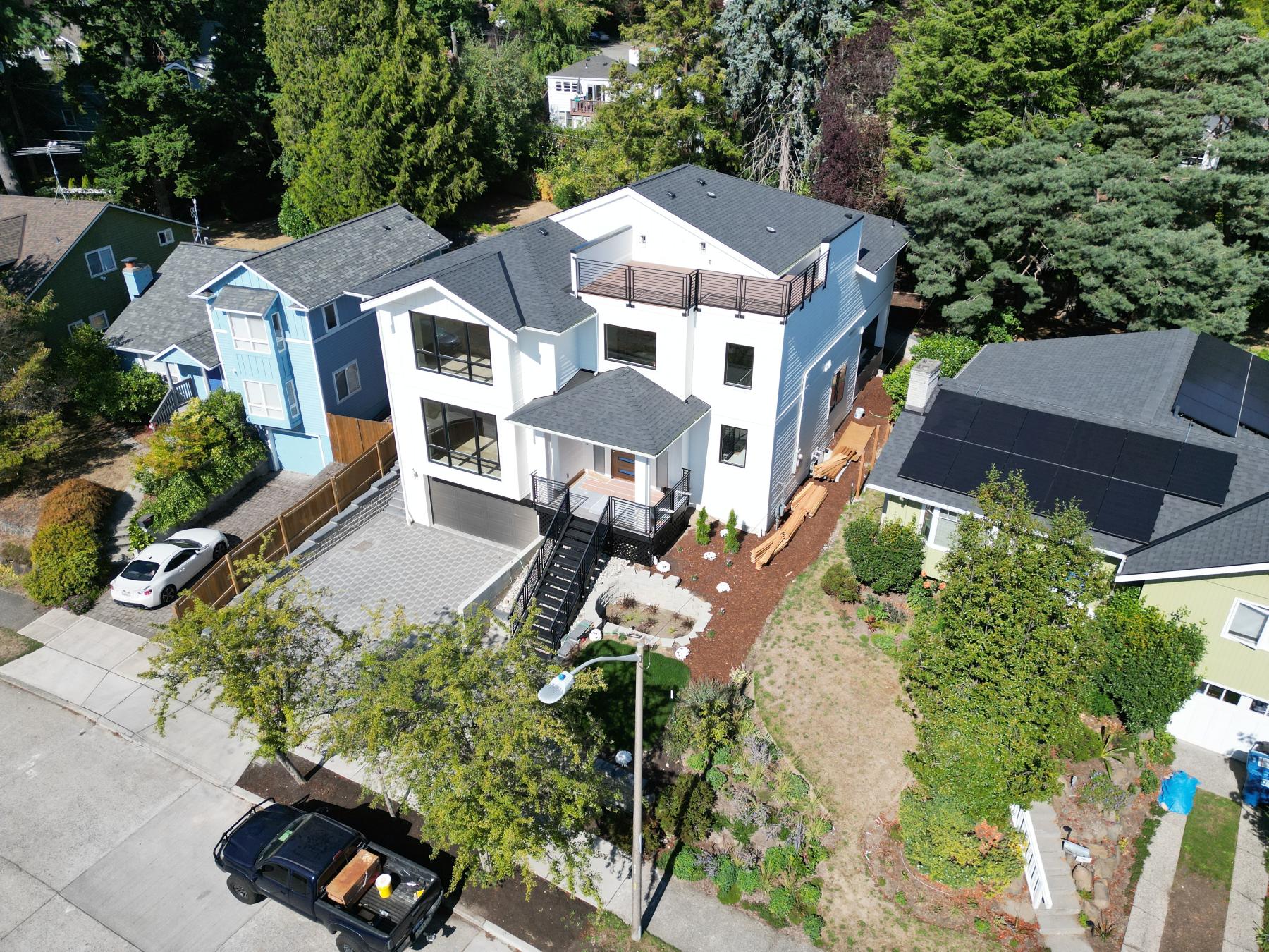 Completed modern custom home in Seattle originally framed by Twin Brothers Group, aerial view